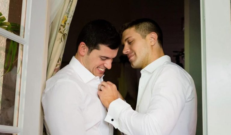 Gio Benitez baptized at an LGBTQ-inclusive Catholic church with husband Tommy DiDario by his side